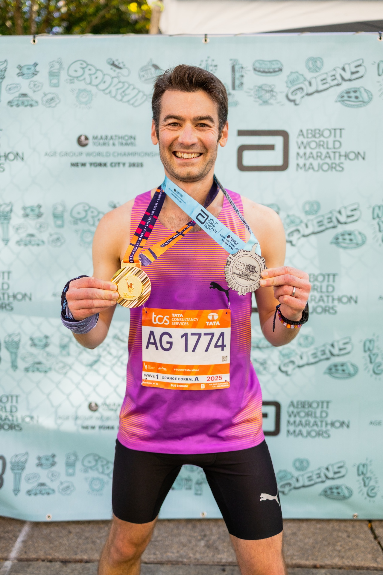 Coach Nick Weston with his TCS New York City Marathon and Abbott Age Group World Championships medals, 2025