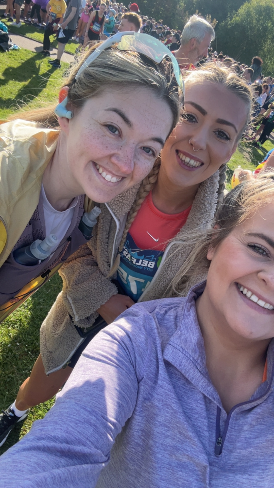 Dale, Michaela and Jennifer celebrating their first marathon finish at Belfast Marathon 2025 after following an RNNNG beginner marathon plan