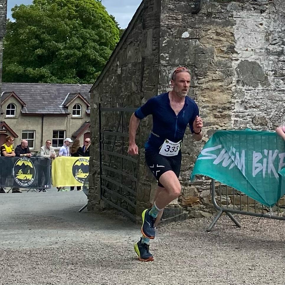 RNNNG coached athlete Mark completing his first triathlon at Beyond The Wall 2026 in 1:30 after two RNNNG marathon builds